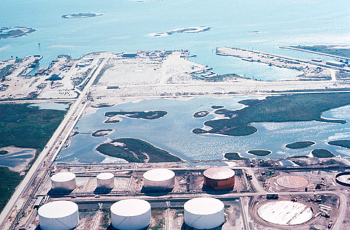 Coastal Texas oil refinery shown as industrial context for hazardous-area robot commissioning.