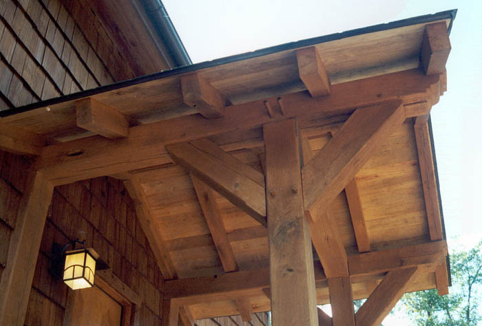 Timber beams and joints beneath a porch roof